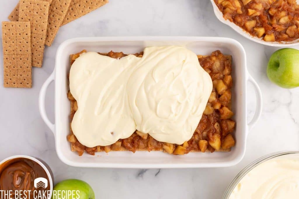 pudding over apple pie filling in a baking dish