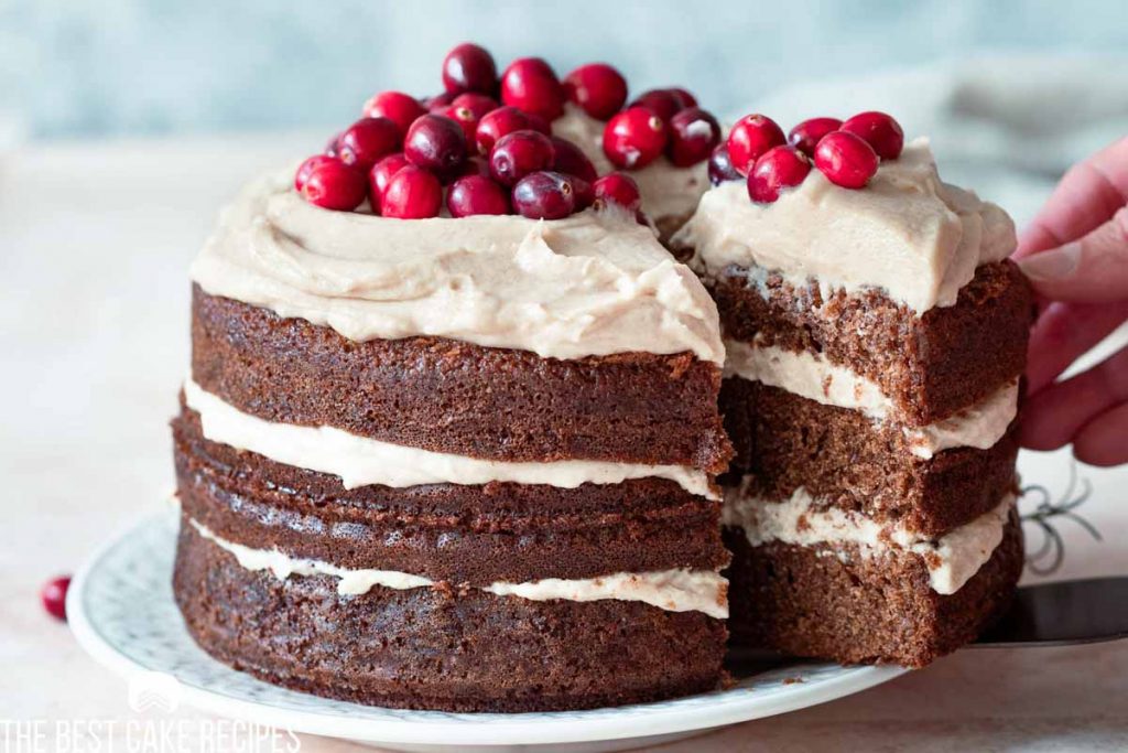 a slice of spice cake pulling out of a cake