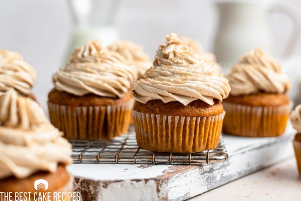 pumpkin spice latte cupcakes sitting on a table