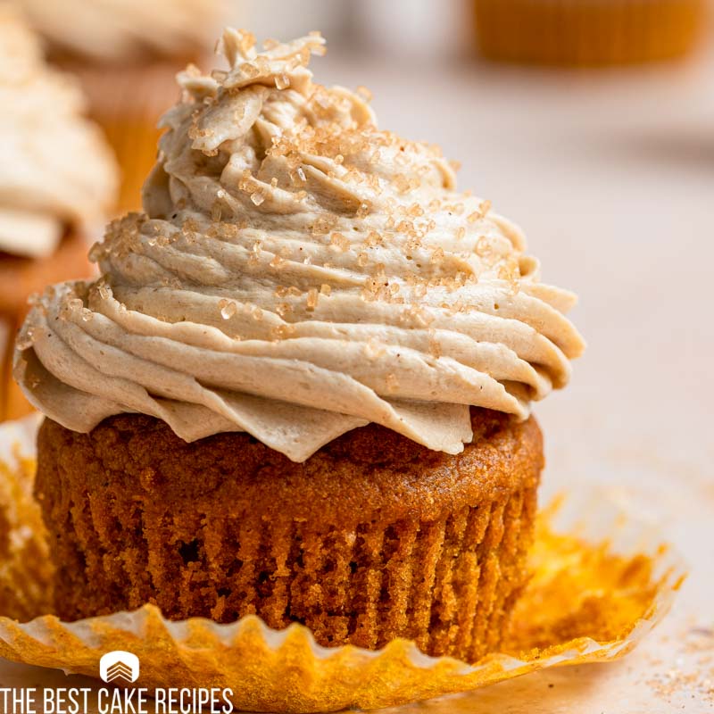 an unwrapped cupcake with coffee frosting