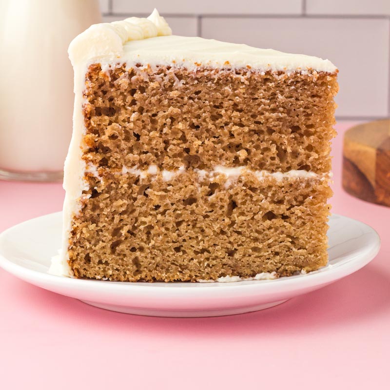 a slice of two layer spice cake on a plate