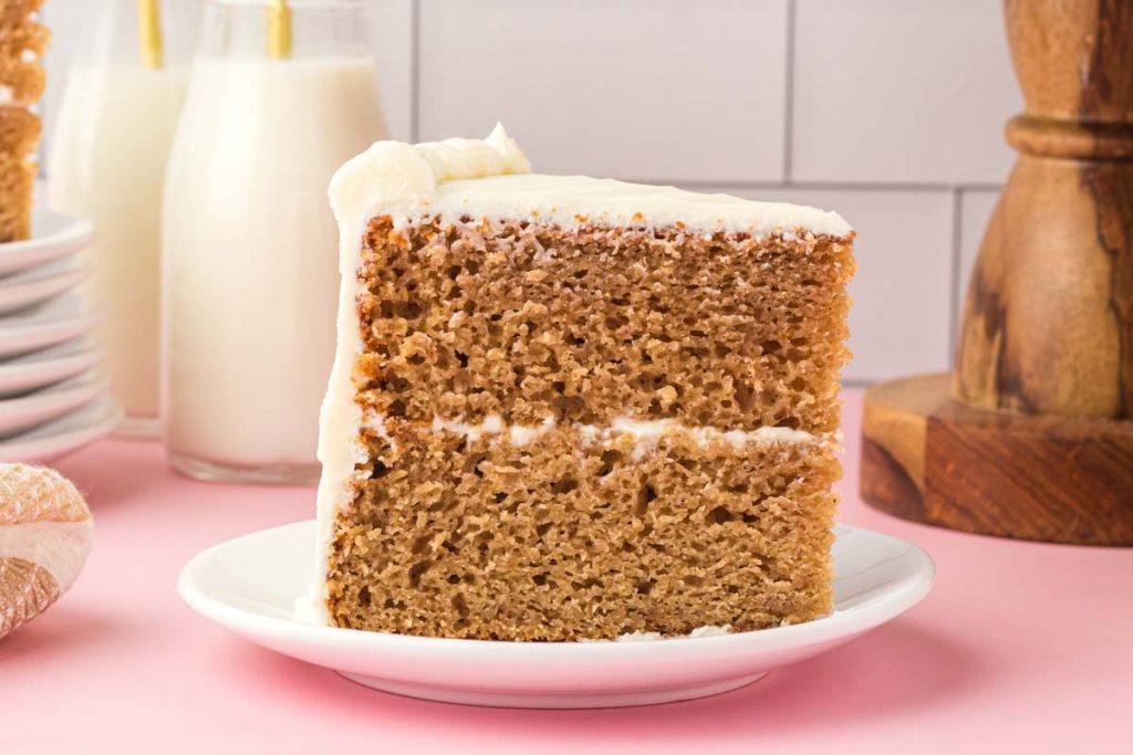 a piece of two layer spice cake on a plate