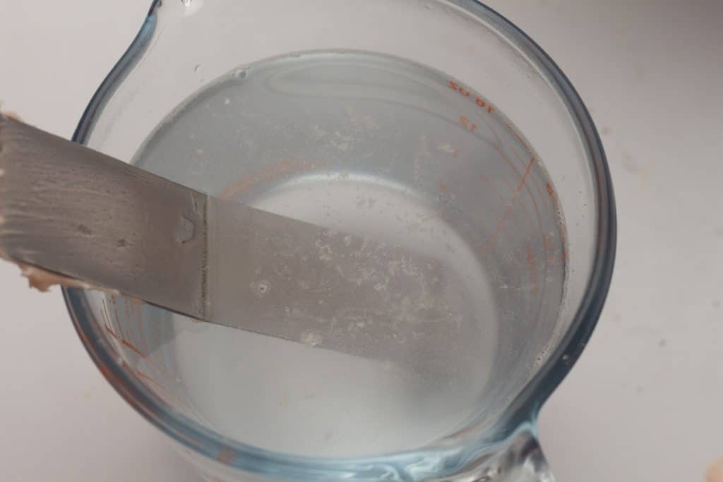 spatula in a glass of hot water