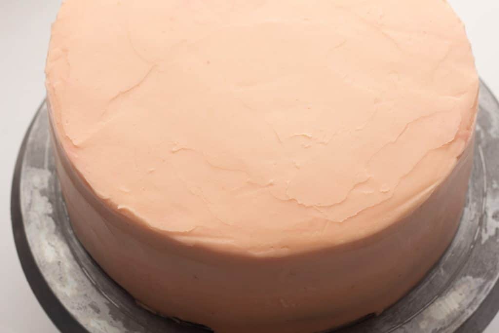 pink frosted layer cake
