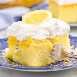 slice of lemon poke cake on a plate