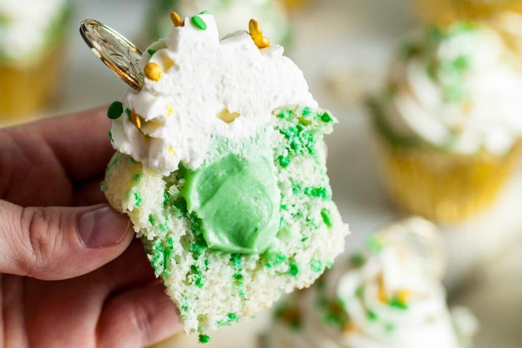 half of a green cupcake with filling