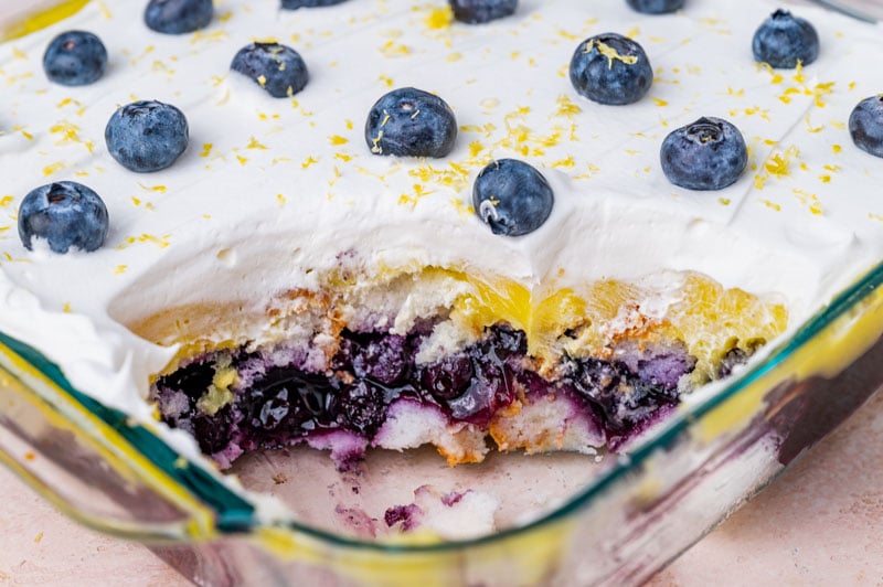 layered lemon blueberry dessert in a pan