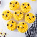 a plate of lion cupcakes