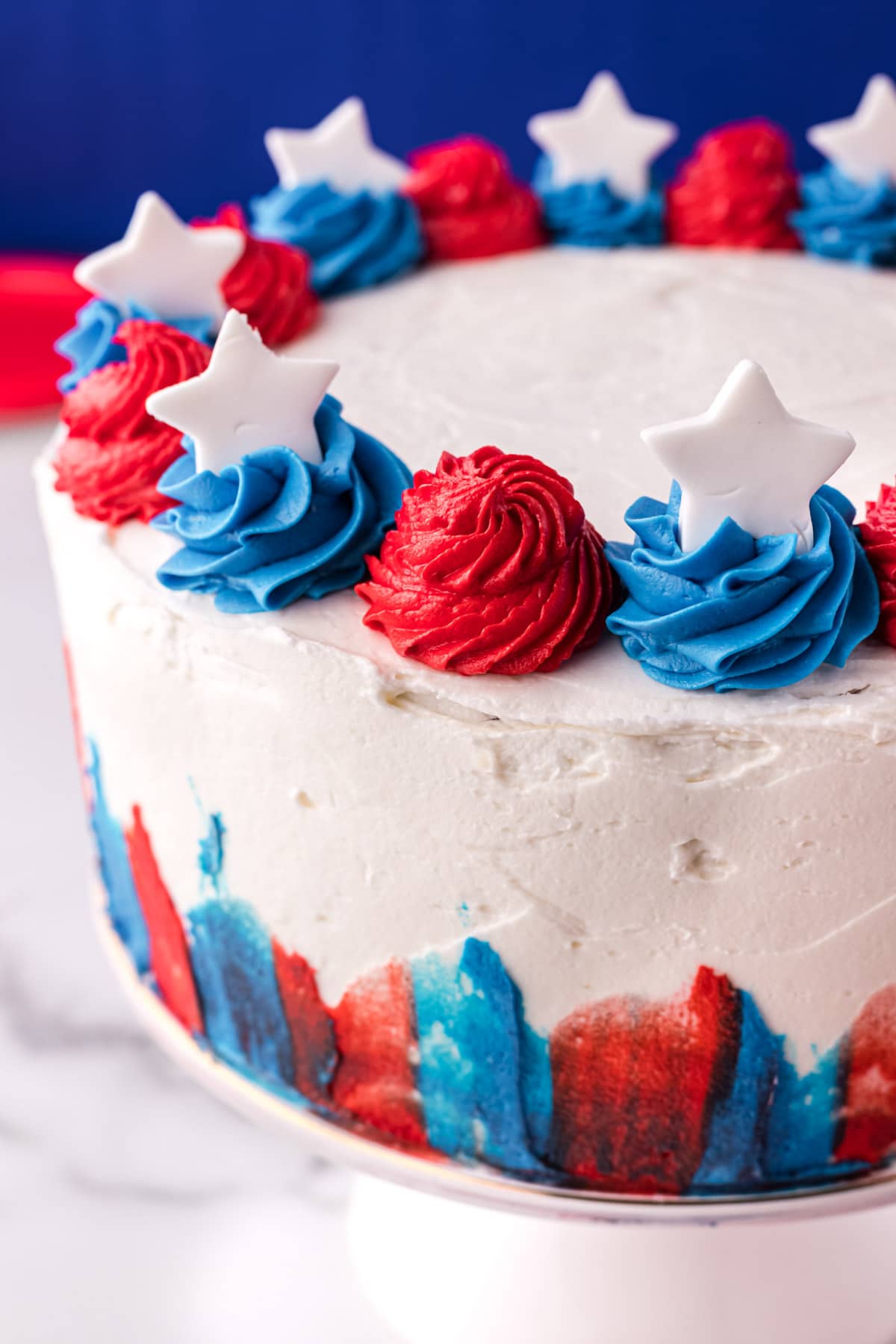 a 4th of july cake with red white and blue frosting and stars