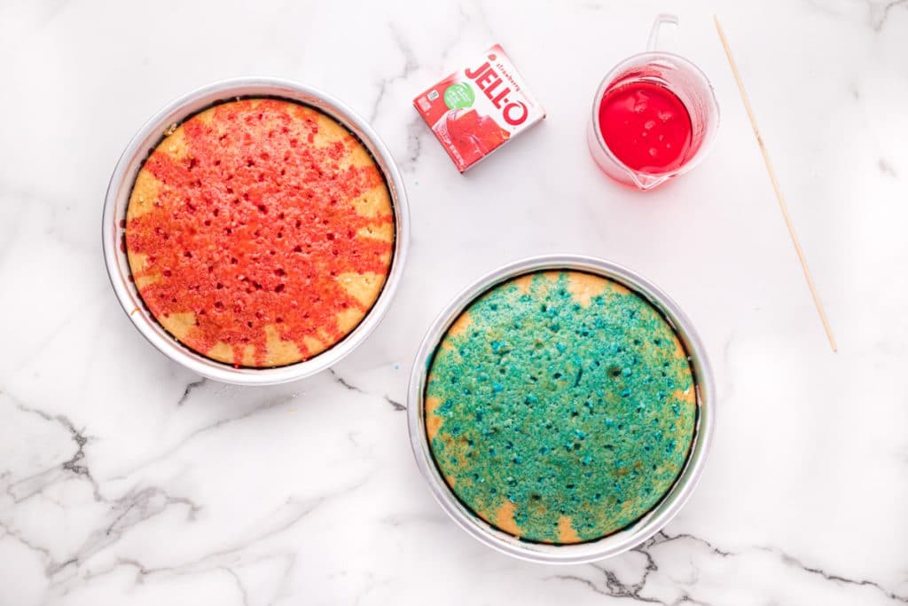 two round cakes, one with red jello and one with blue