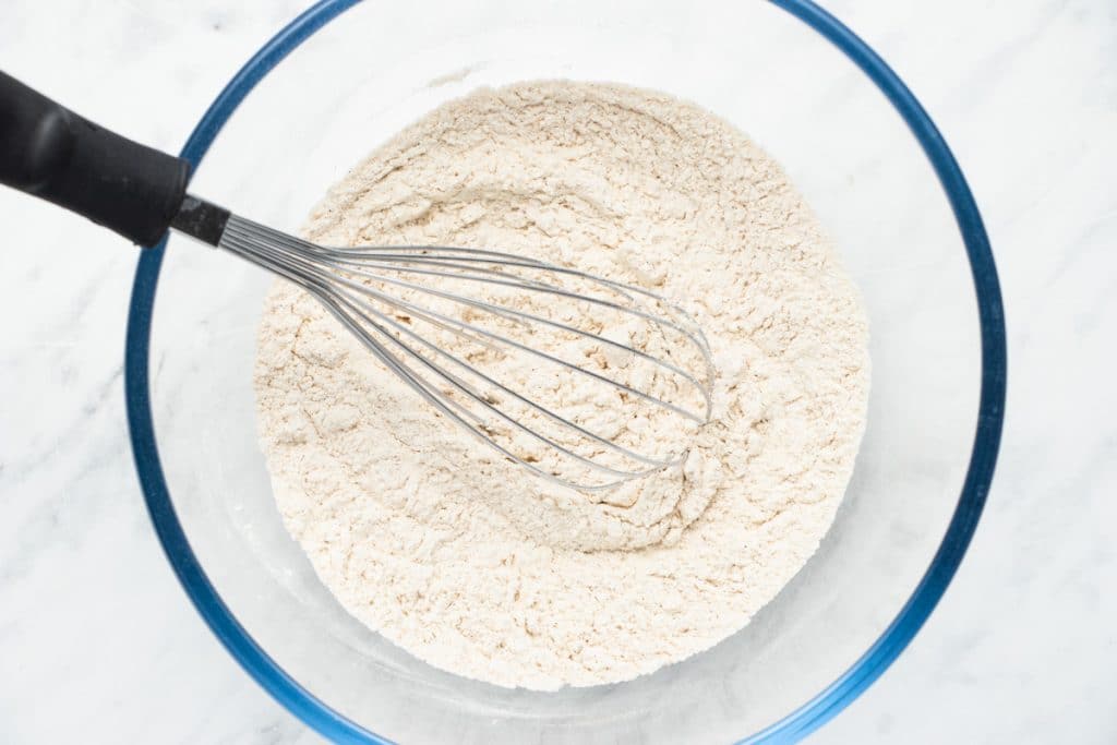 dry ingredients in a mixing bowl with a whisk