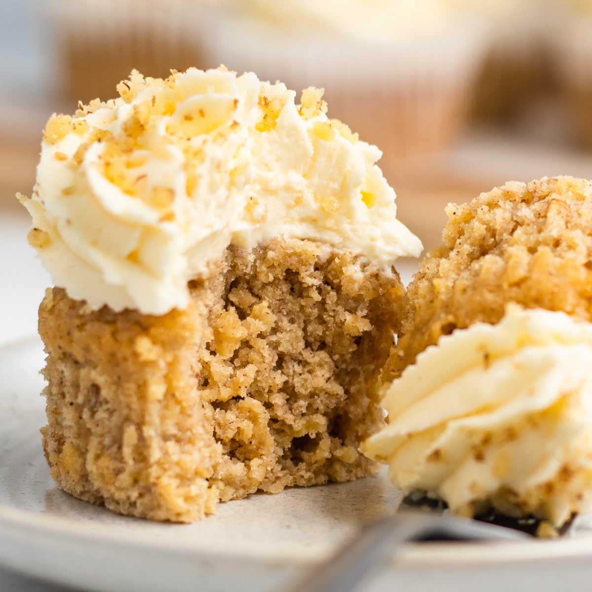 half of a banana cupcake on a plate