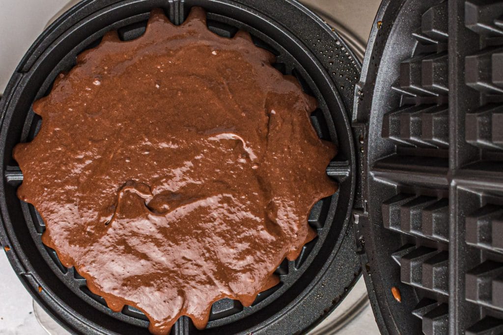 chocolate batter in a waffle maker