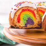 closeup of rainbow bundt cake on a spatula
