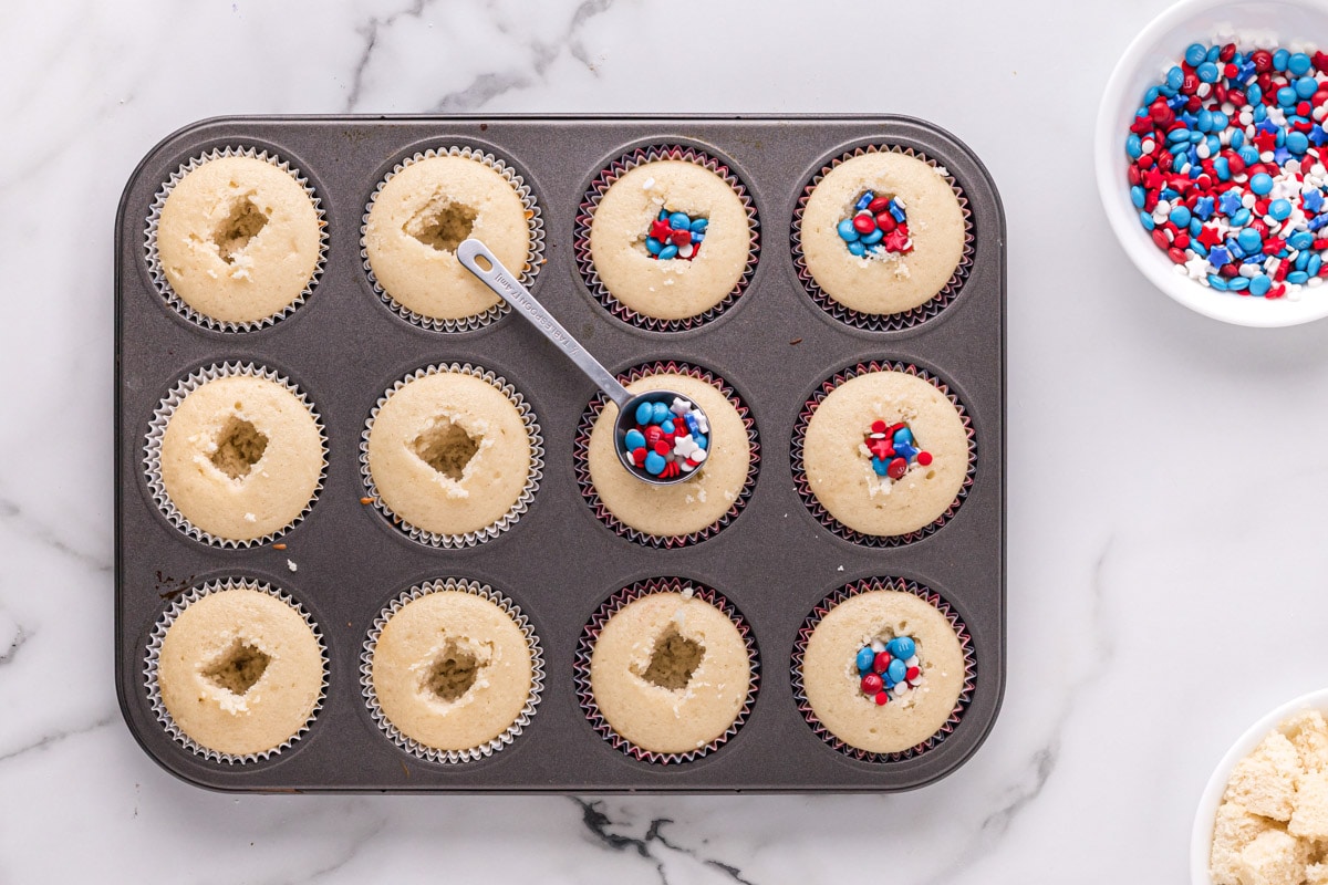 overhead view of july 4th cupcakes filled with mini m&ms and sprinkles