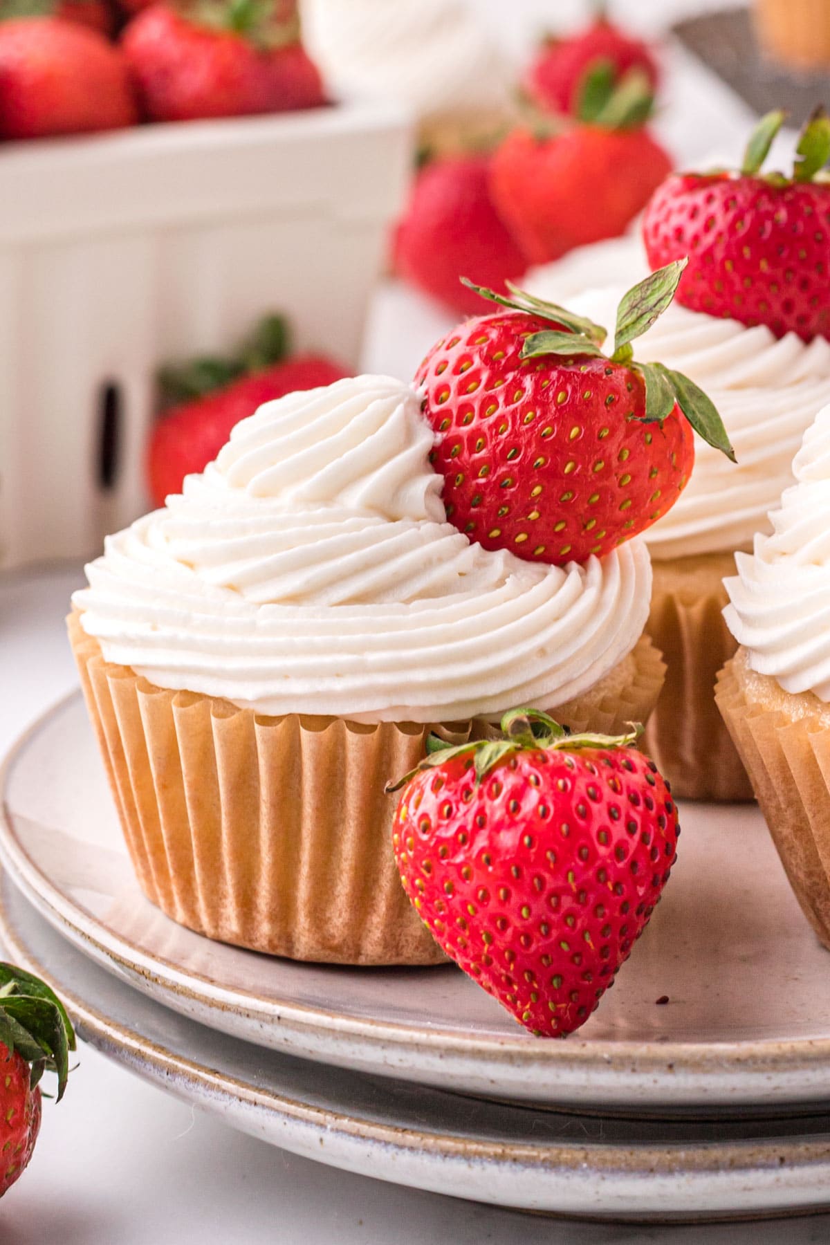 closeup of a cupcake with a strawberry on top