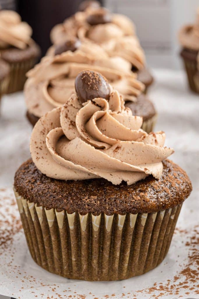 a mocha coffee cupcake with frosting on top