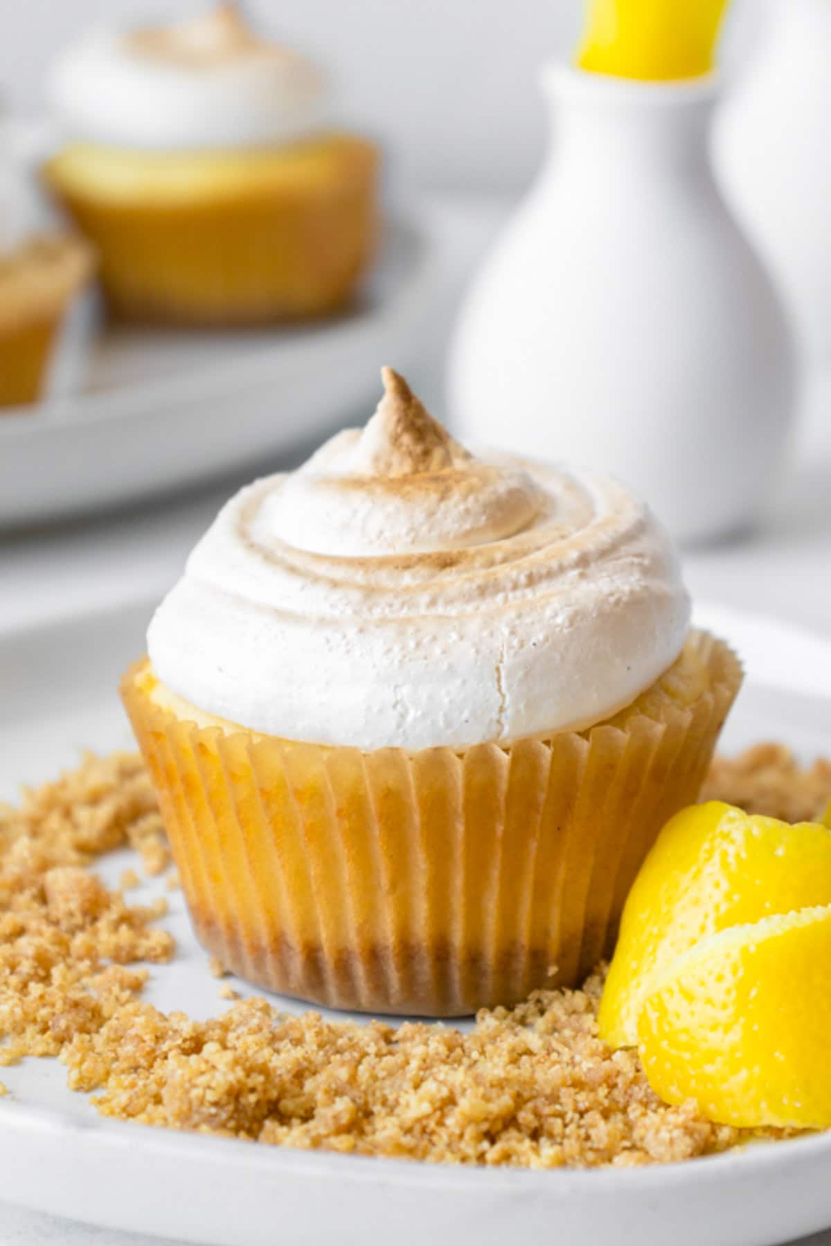 a lemon cupcake on a table with lemon