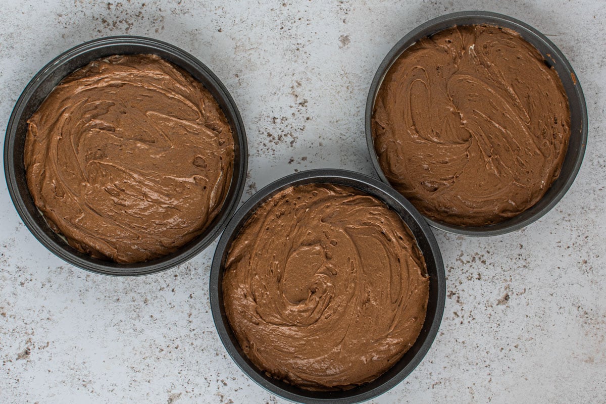 3 round unbaked chocolate cakes