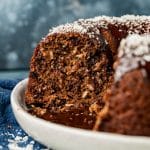 a german chocolate bundt cake with coconut on a plate