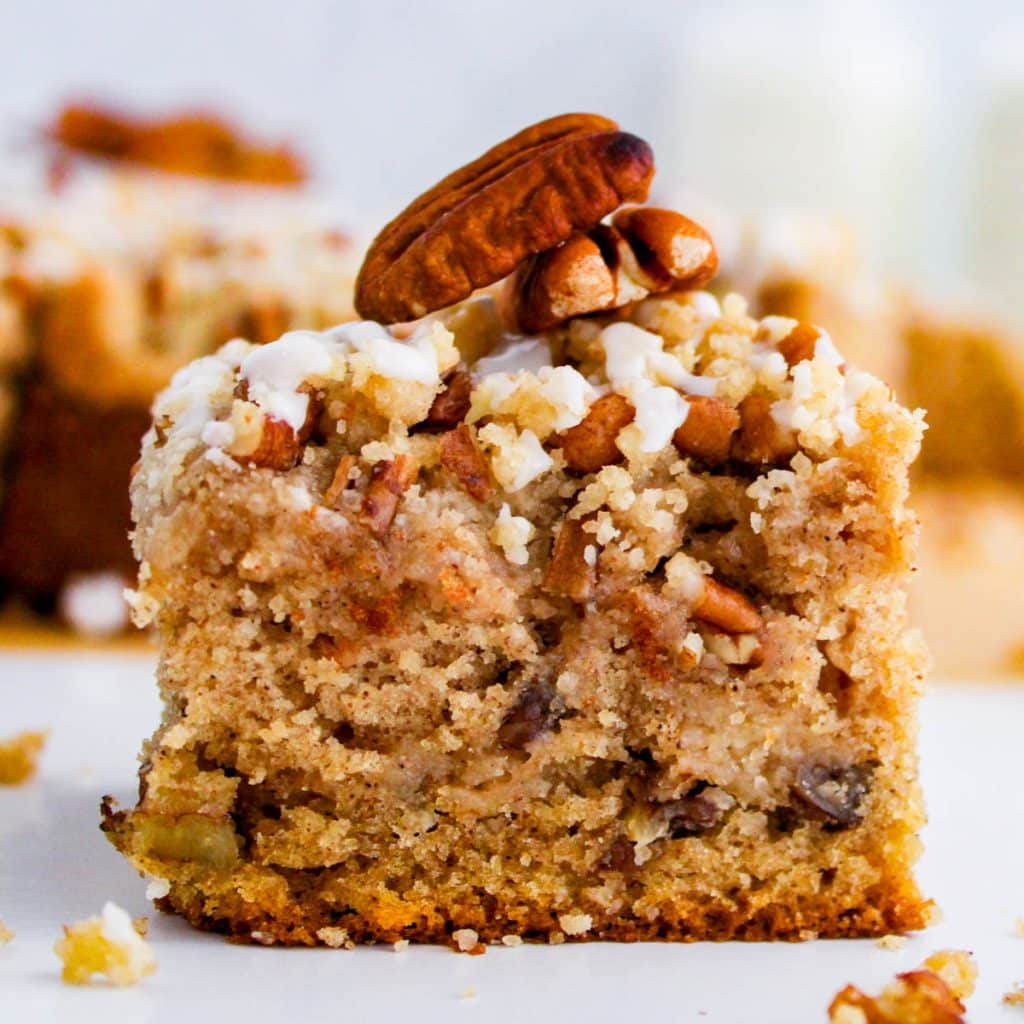 a piece of maple pecan coffee cake with crumb topping
