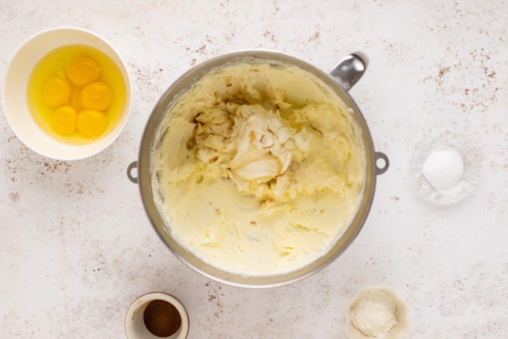 cream cheese and sugar mixed in a mixing bowl