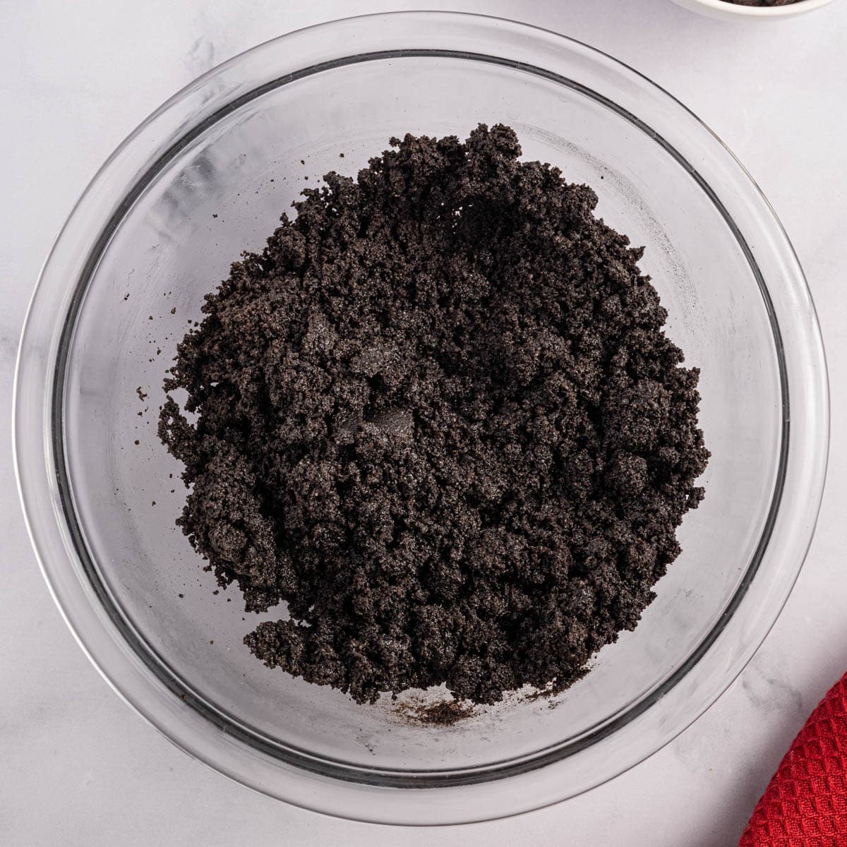 crushed Oreo cookies in a mixing bowl