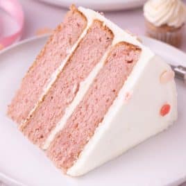 a piece of strawberry layer cake on a plate