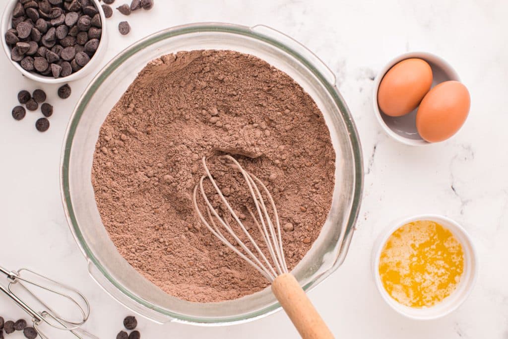 cake mix and cocoa powder whisked together in a glass bowl