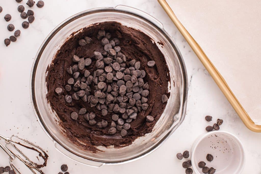 chocolate cookie dough with chocolate chips on top