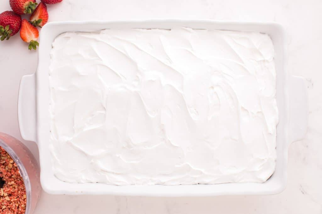 a cake frosted with whipped cream