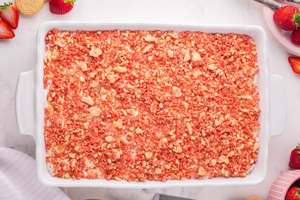 overhead view of strawberry crunch poke cake