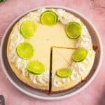overhead view of a lime cheesecake with 2 slices cut
