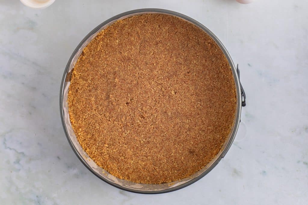 graham cracker crust in a springform pan
