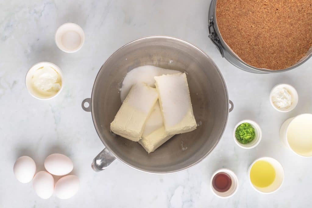 cream cheese and sugar in a mixing bowl