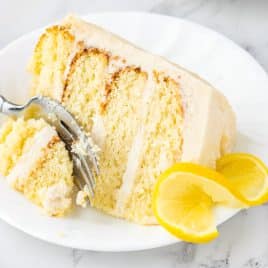 a piece of lemon cake on a plate with a fork