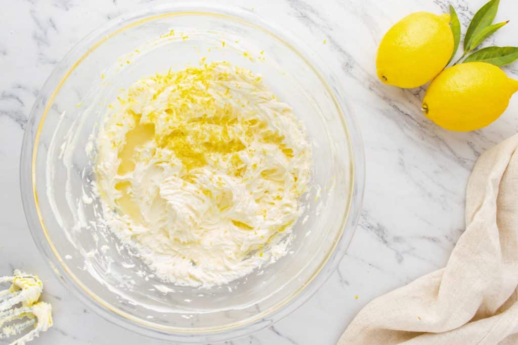 cream cheese frosting with lemon zest in a glass bowl