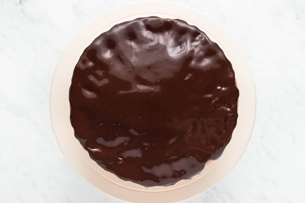 a cake glazed with chocolate ganache